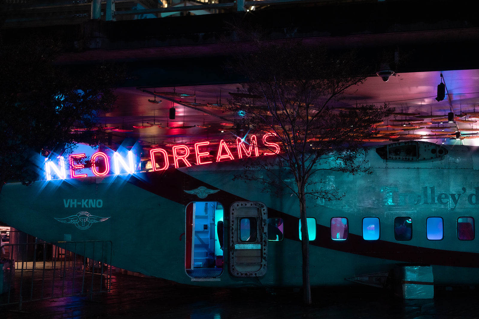 Neon Dreams aircraft installation by Trolley’d at Darling Harbour during Vivid Sydney 2025