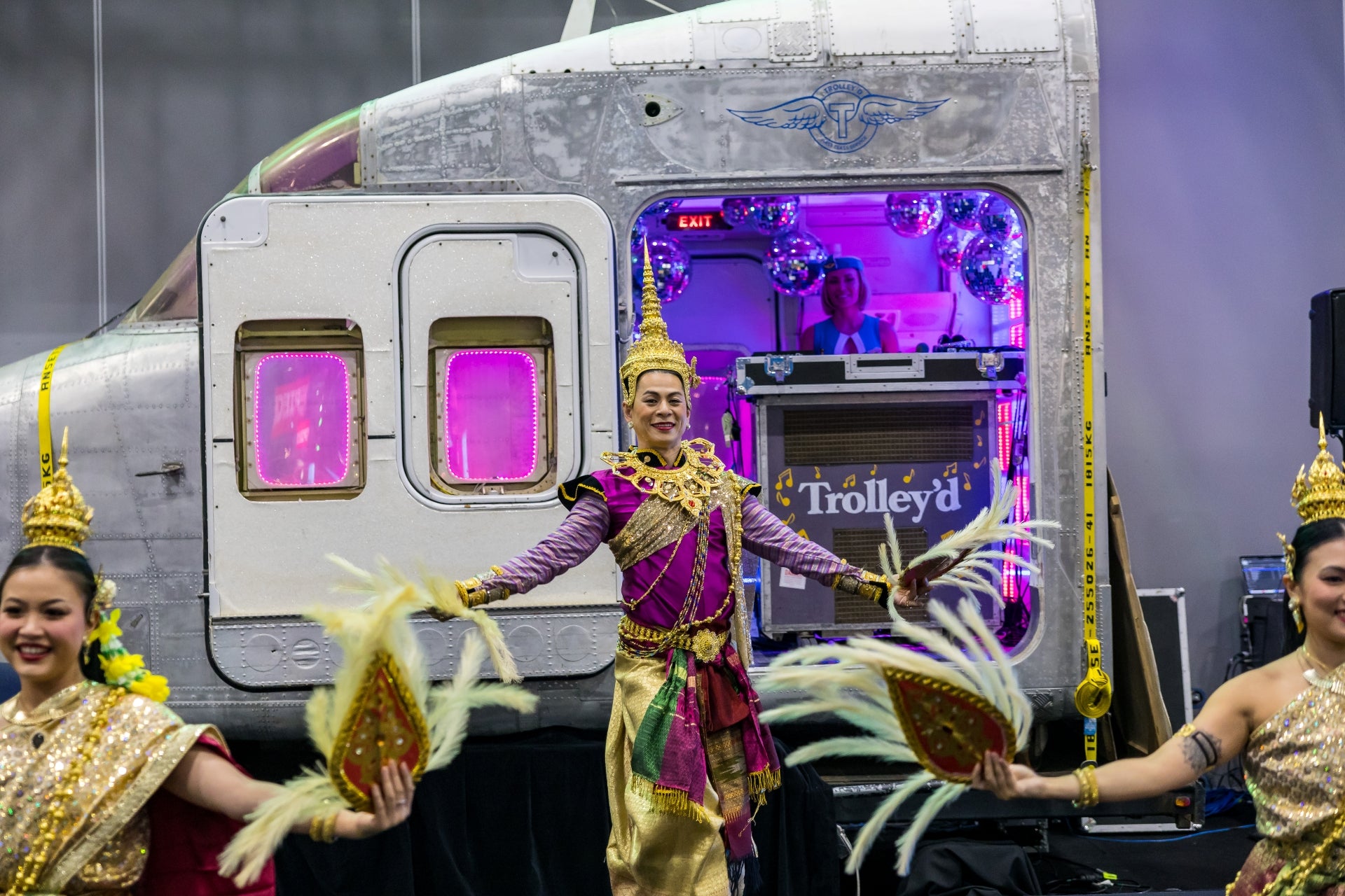 Traditional performance activation staged in front of Trolley’d aircraft cockpit installation at AIME 2026 Hosted Buyer Lounge