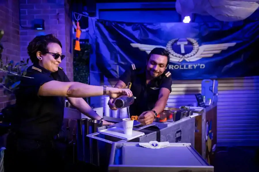 Black flight attendant uniform with gold epaulets and collar insignia