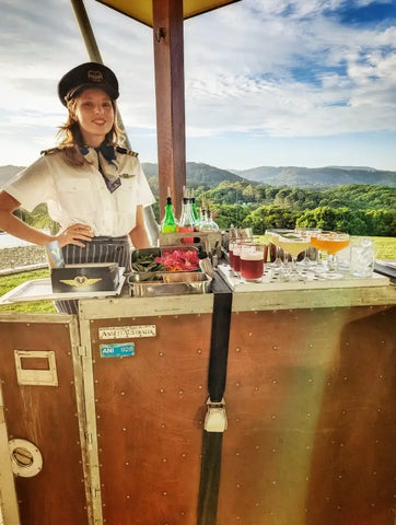 Luxurious Copper Mobile Bar Setup by Trolley'd in a Picturesque Outdoor Location