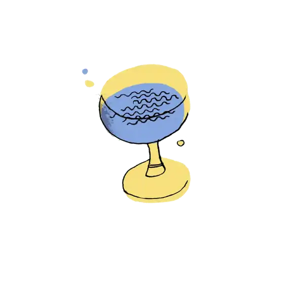 Yellow stemmed cocktail glass filled with blue liquid and decorative swirls.